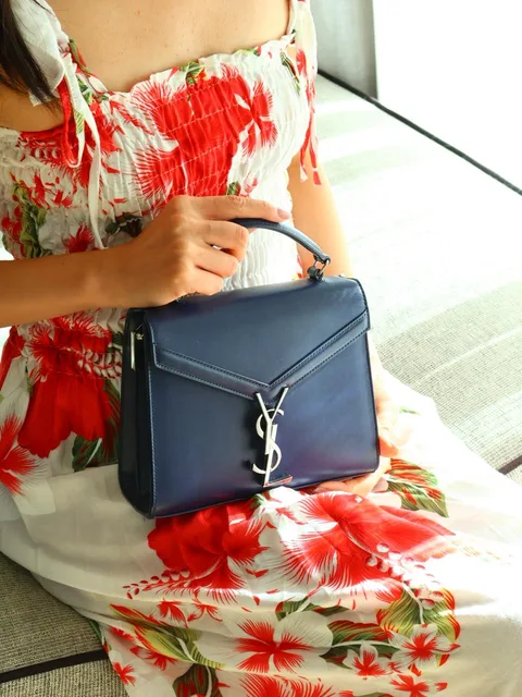 Hannah H., Kaya member with designer bag