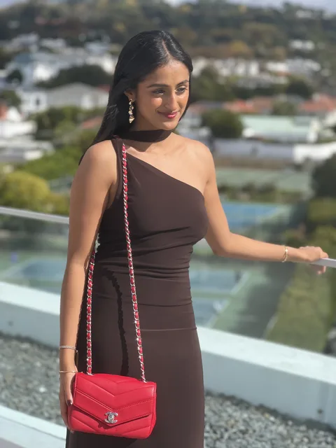 Khevna R., Kaya member with designer bag